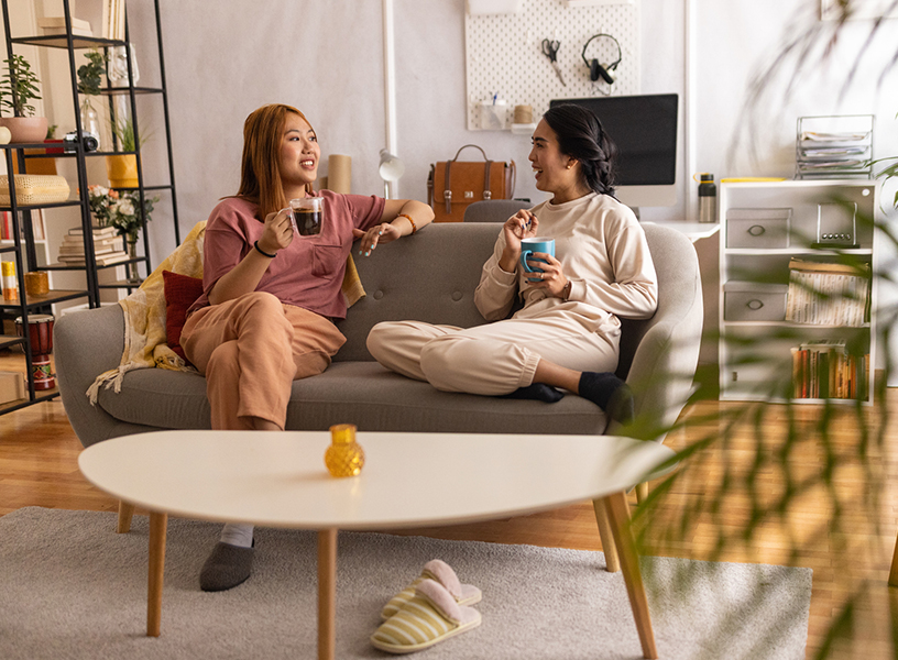 two young women relaxing at home